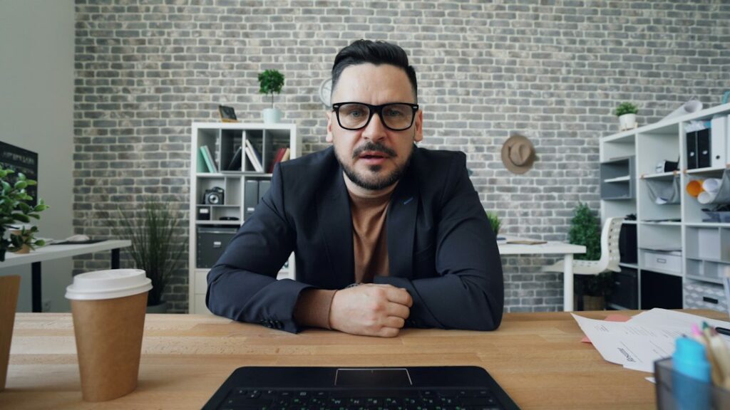 Professional participating in an online conversation at a desk